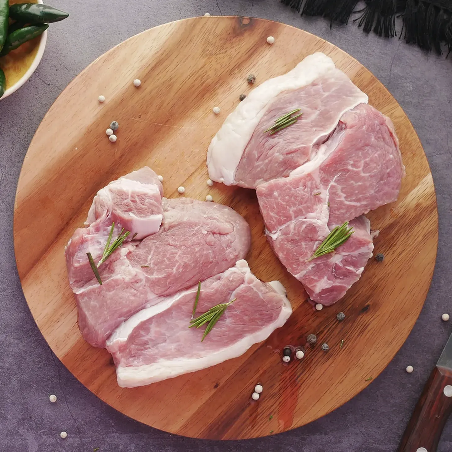 Lamb cutlet on platter prior to cook